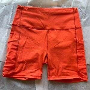 Fabletics 6in Orange On-The-Go Shorts, Size Large